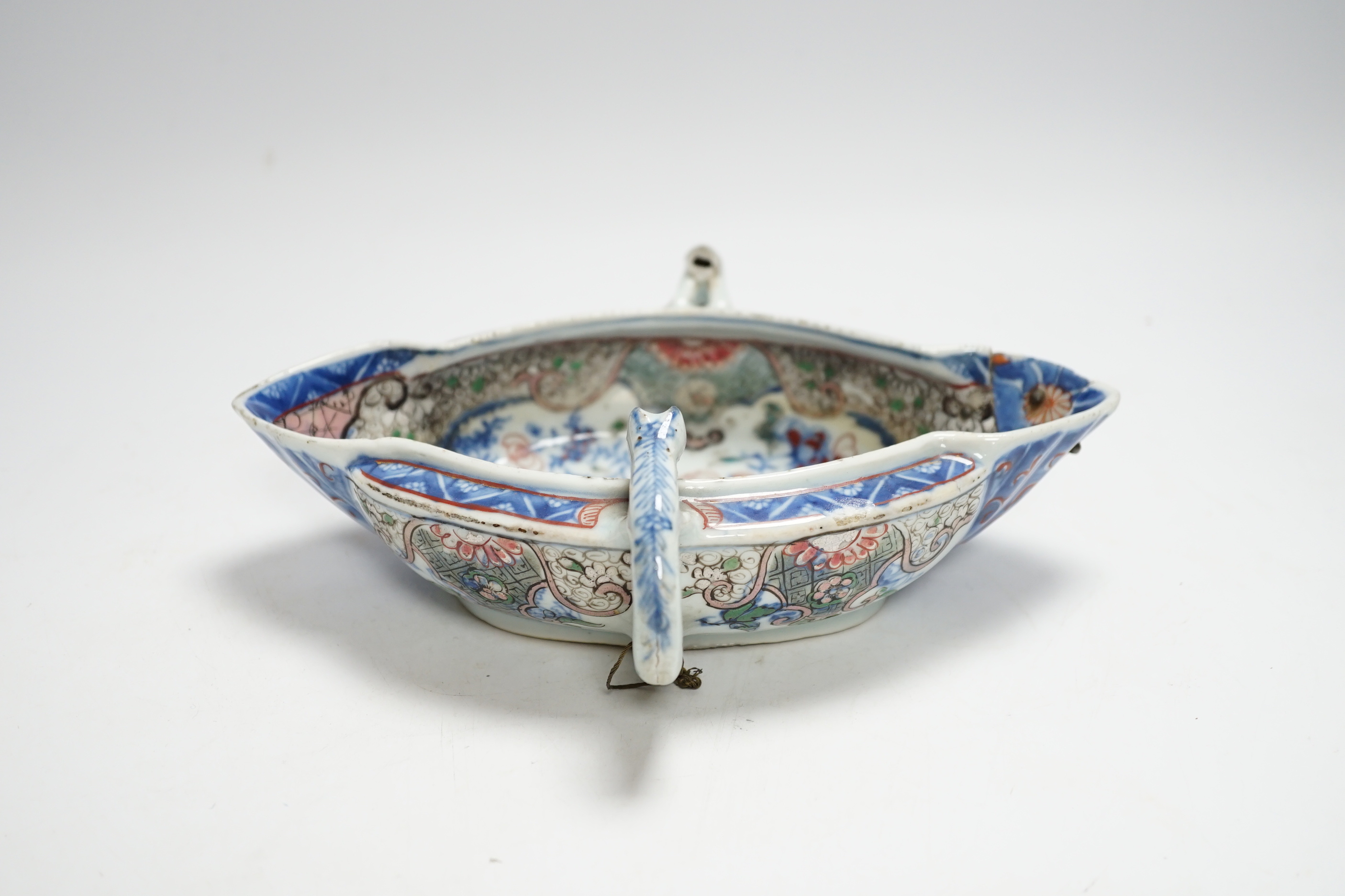 A Chinese clobbered blue and white double lipped sauceboat, Qianlong period, 23cm high